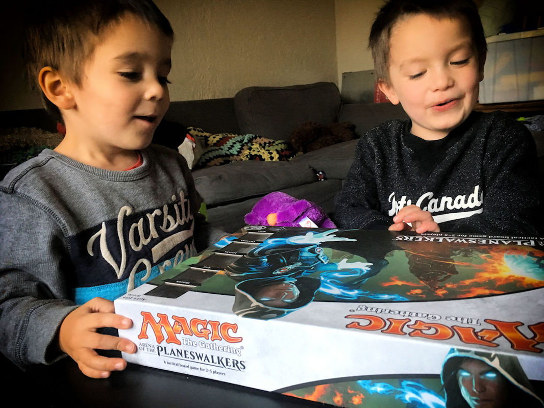 Twin boys playing Magic: Arena of the Planeswalkers. So excited!